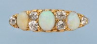 Lot 694 - An opal and diamond ring, the three graduated...