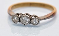 Lot 695 - A three stone diamond ring, transitional...