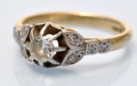 Lot 696 - A diamond ring, the central brilliant cut...