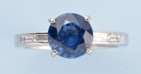 Lot 697 - A sapphire and diamond ring, the circular...