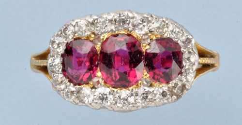 Lot 699 - A Victorian ruby and diamond cluster ring, the...