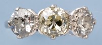 Lot 705 - A three stone diamond ring, the central old...