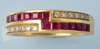 Lot 719 - A ruby and diamond ring, set with twelve eight-...