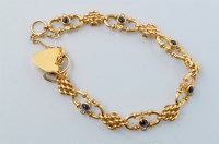 Lot 727 - A sapphire and diamond set 18ct. yellow gold...