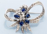 Lot 740 - A sapphire and diamond brooch, of flower and...