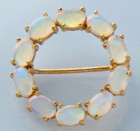 Lot 755 - A water opal brooch, the ten oval cabochons in...