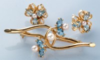 Lot 760 - A blue topaz and cultured pearl brooch, the...