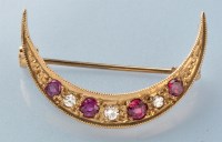 Lot 761 - A ruby and diamond crescent form brooch, in...