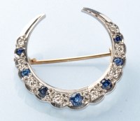 Lot 764 - A sapphire and diamond crescent brooch, the...