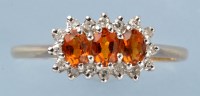 Lot 772 - A citrine and diamond ring, with three oval...