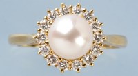 Lot 775 - A cultured peal and diamond cluster ring, the...