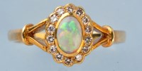 Lot 778 - An opal and diamond ring, the oval opal...