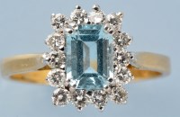 Lot 779 - An aquamarine and diamond cluster ring, the...