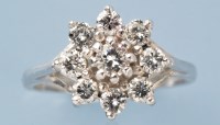 Lot 781 - A diamond cluster ring, the central brilliant...