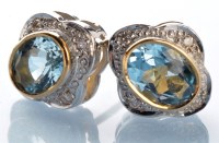 Lot 787 - A pair of aquamarine and diamond cluster stud...