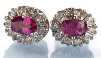 Lot 792 - A pair of ruby and diamond cluster stud...