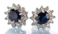 Lot 800 - A pair of sapphire and diamond cluster stud...