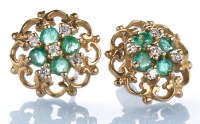 Lot 802 - A pair of emerald, diamond and 9ct. yellow...