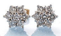 Lot 803 - A pair of diamond cluster earrings, each set...