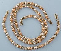 Lot 807 - A yellow, white and rose coloured metal...