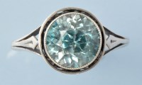 Lot 808 - A blue zircon ring, the circular facet cut...