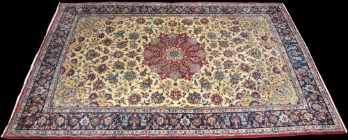 Lot 817 - A Tabriz carpet, the central rosette on ivory...