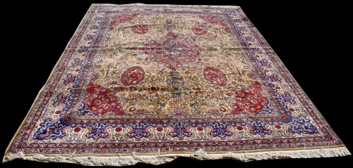 Lot 820 - A Tabriz carpet, the central floral medallion...