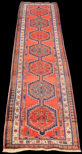 Lot 821 - A Sarab runner, with six medallions on a red...