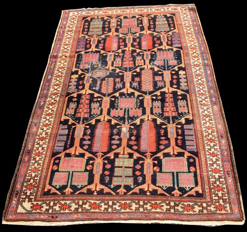 Lot 823 - A Bakhtiari rug, with geometric floral panels...