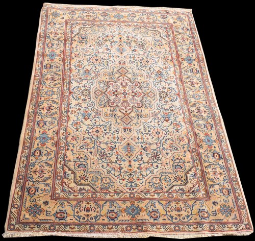 Lot 827 - A Kashan rug, the ivory ground with full...