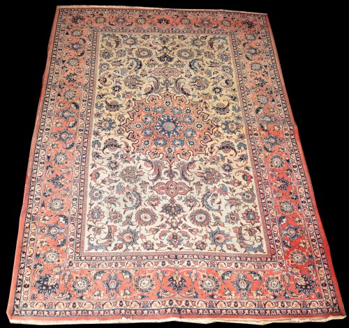 Lot 830 - An Isfahan rug, the central red medallion...