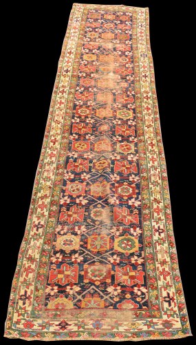 Lot 835 - A Caucasian runner, with bold geometric floral...