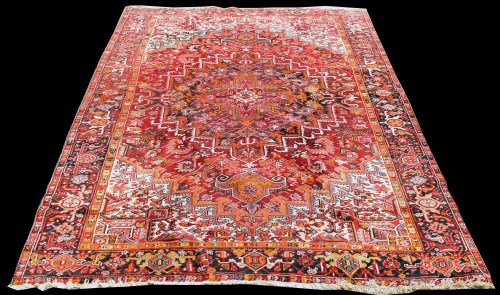 Lot 838 - A Heriz carpet, with bold geometric floral...