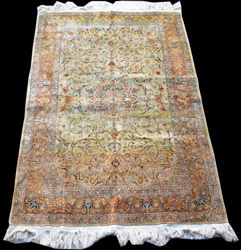 Lot 848 - A Qum silk rug, with scrolling design on gold...