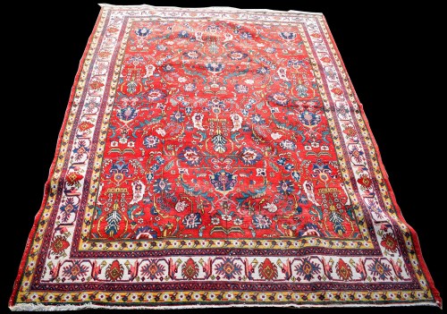 Lot 855 - A Tabriz carpet, with scrolling floral design...
