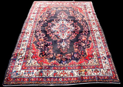 Lot 857 - A Kashan carpet, the floral medallion on blue...