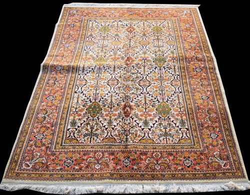 Lot 866 - A Tabriz carpet, with floral panels on ivory...