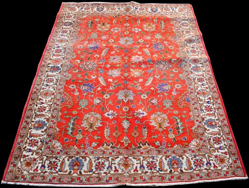 Lot 868 - A Tabriz carpet, with floral scrolling design...