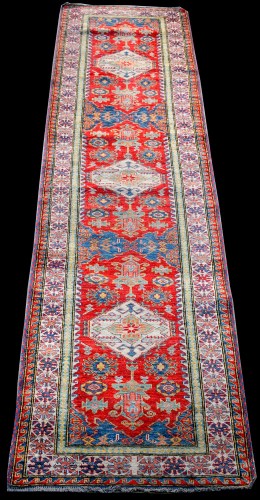Lot 869 - An Afghan runner, with three diamond-shaped...
