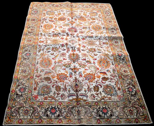 Lot 870 - A Tabriz carpet, the bold floral scrolls on...