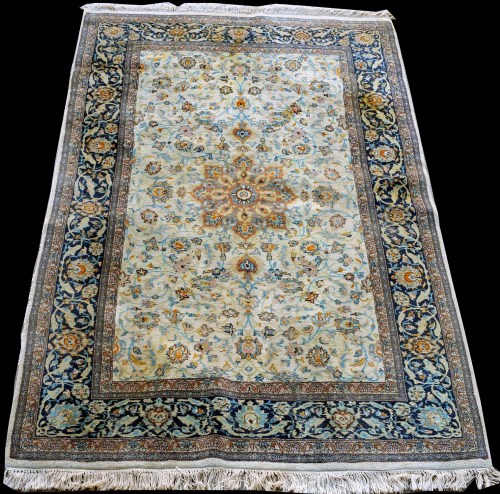 Lot 873 - An Indian rug, with floral design on ivory...