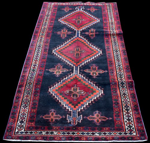Lot 876 - A Hamadan Luri rug, with triple medallion...