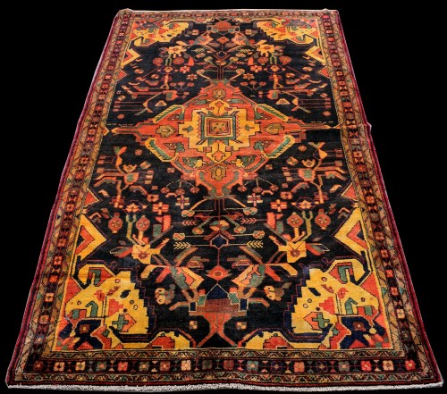 Lot 877 - A Hamadan Luri rug, with geometric floral...