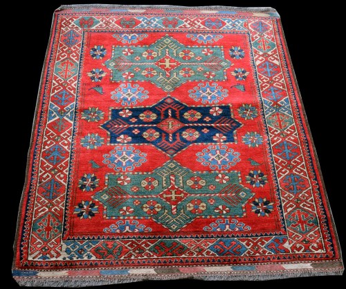 Lot 878 - A Caucasian style rug, with three medallions...