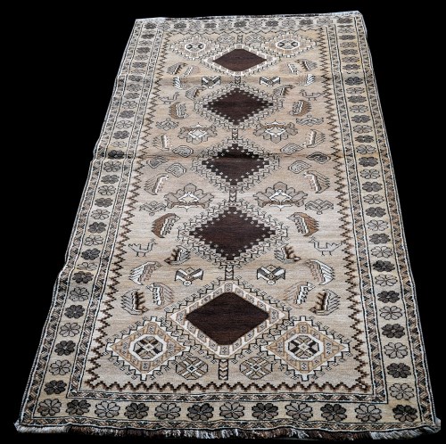 Lot 880 - A Qashqai rug, the brown field with five...