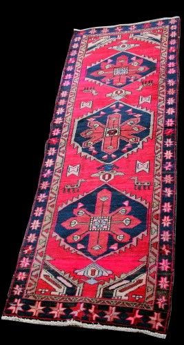 Lot 887 - A Persian runner, with diamond-shaped...