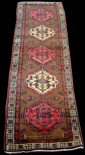Lot 888 - A Persian runner, with five medallions on...