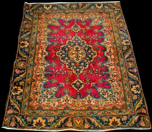 Lot 894 - A Persian rug, with floral central medallion...