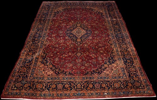 Lot 897 - A Kashan carpet, with central floral medallion...