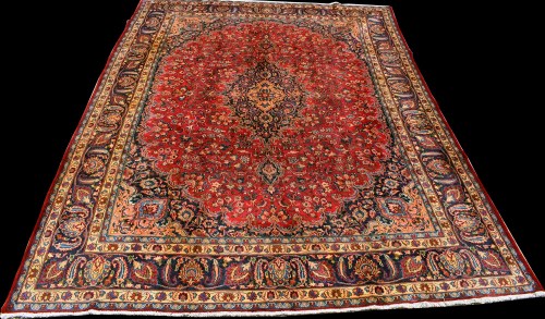 Lot 898 - A Mashad carpet, the central medallion on red...